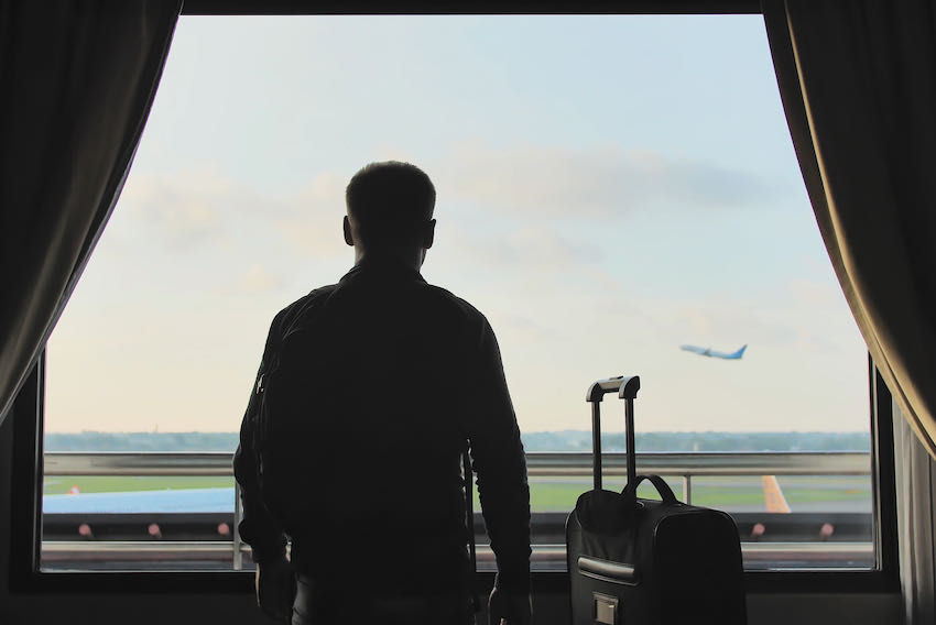 Hotel room suitcase runway view airport